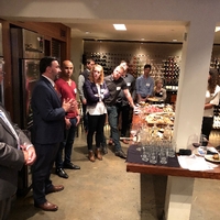 Alumni gathered at reception in Wine cellar